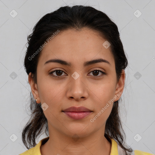 Joyful latino young-adult female with medium  brown hair and brown eyes