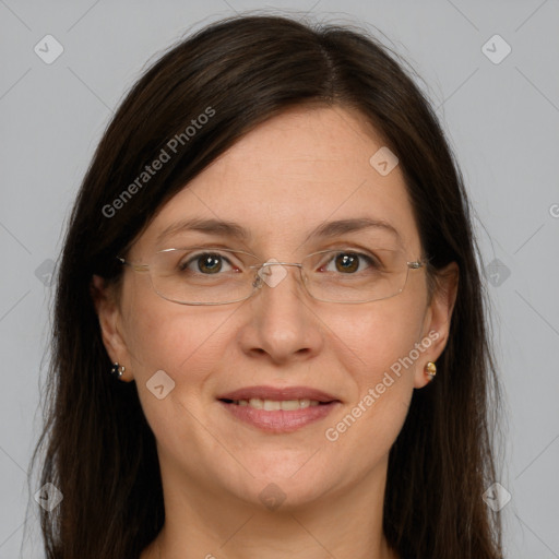 Joyful white adult female with long  brown hair and grey eyes