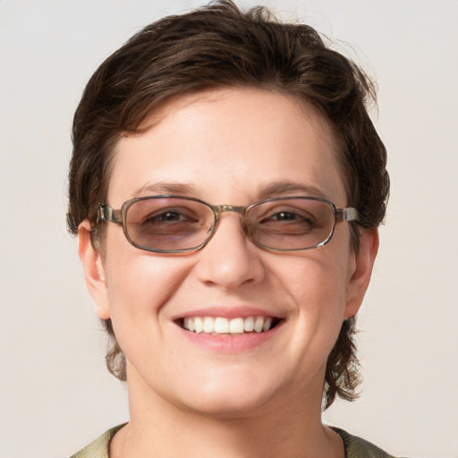 Joyful white adult female with medium  brown hair and blue eyes