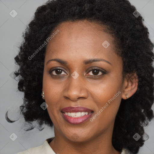 Joyful black young-adult female with medium  brown hair and brown eyes