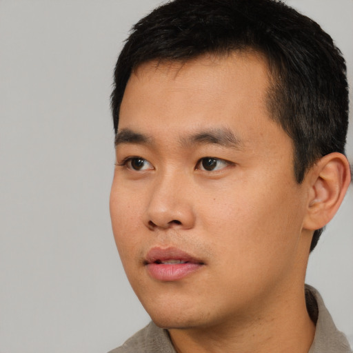 Neutral asian young-adult male with short  black hair and brown eyes