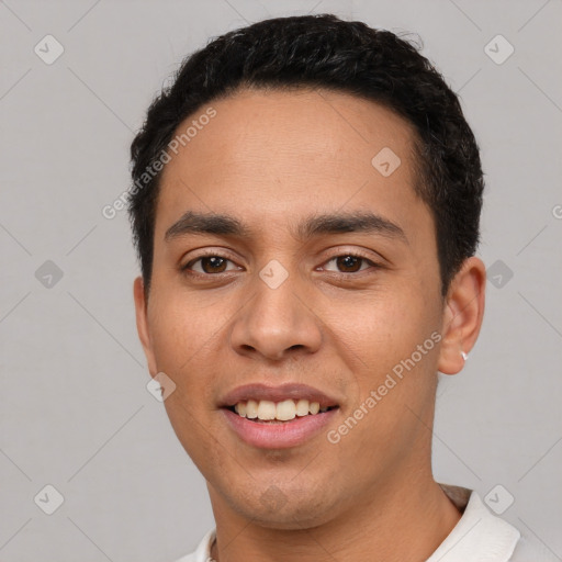 Joyful white young-adult male with short  black hair and brown eyes