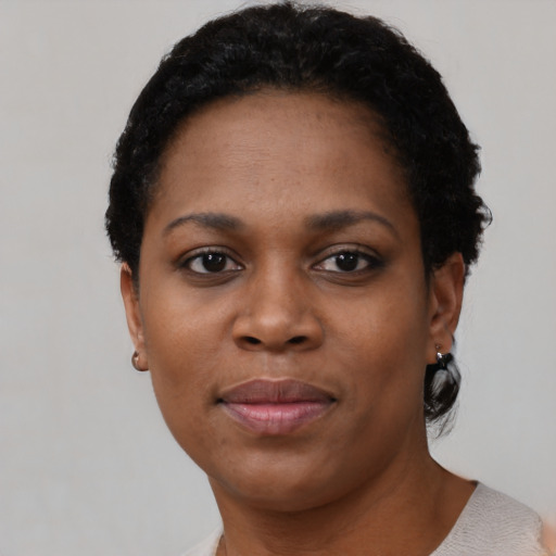 Neutral black young-adult female with short  black hair and brown eyes