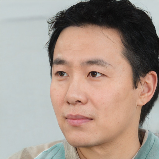 Neutral white adult male with short  black hair and brown eyes
