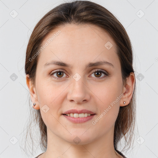 Joyful white young-adult female with medium  brown hair and brown eyes