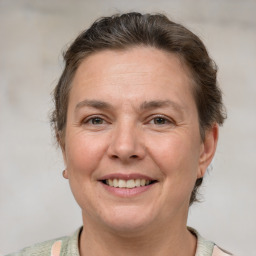 Joyful white adult female with short  brown hair and brown eyes