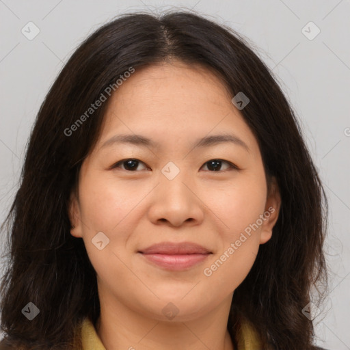 Joyful asian young-adult female with medium  brown hair and brown eyes