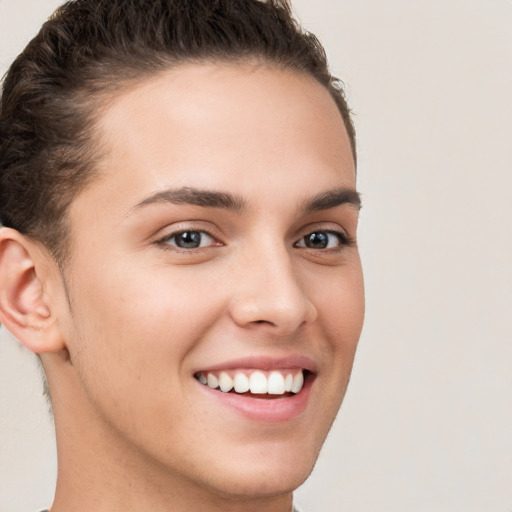 Joyful white young-adult female with short  brown hair and brown eyes