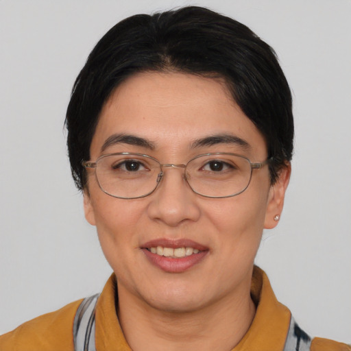 Joyful white young-adult female with short  black hair and brown eyes
