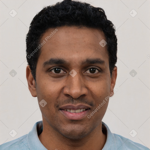 Joyful black young-adult male with short  black hair and brown eyes