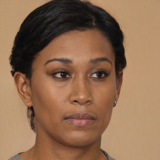 Neutral black young-adult female with medium  black hair and brown eyes