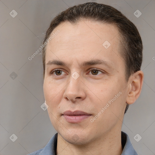 Joyful white adult male with short  brown hair and brown eyes