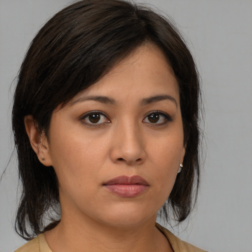 Neutral asian young-adult female with medium  brown hair and brown eyes