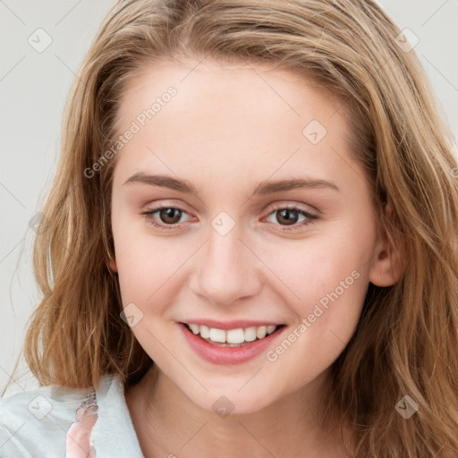 Joyful white young-adult female with long  brown hair and blue eyes