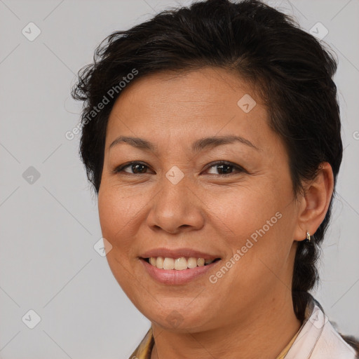 Joyful white adult female with medium  brown hair and brown eyes