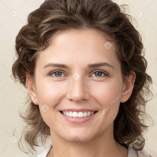 Joyful white young-adult female with medium  brown hair and green eyes