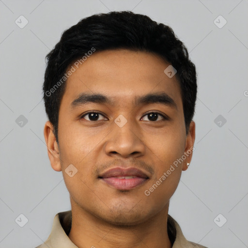 Joyful latino young-adult male with short  black hair and brown eyes