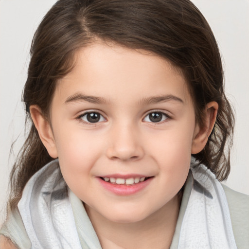 Joyful white child female with medium  brown hair and brown eyes