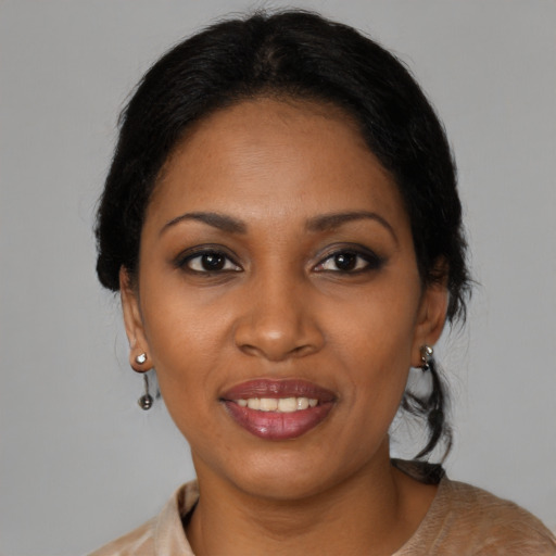Joyful black young-adult female with medium  black hair and brown eyes