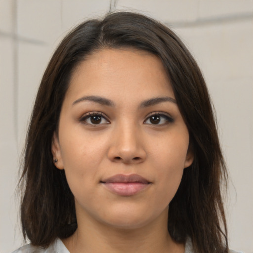 Neutral latino young-adult female with medium  brown hair and brown eyes