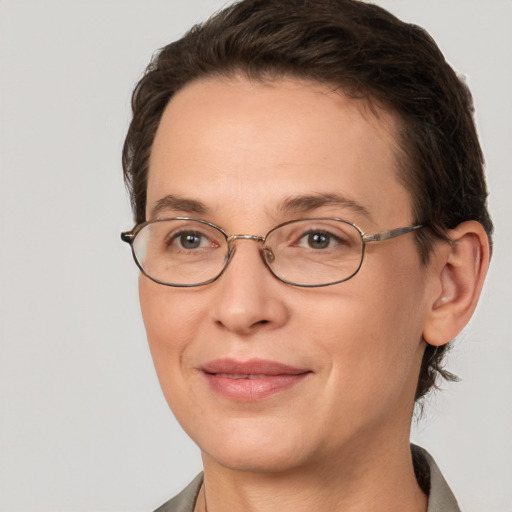 Joyful white adult female with short  brown hair and brown eyes