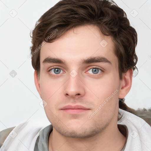 Neutral white young-adult male with short  brown hair and grey eyes