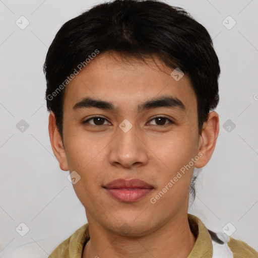 Joyful latino young-adult male with short  brown hair and brown eyes