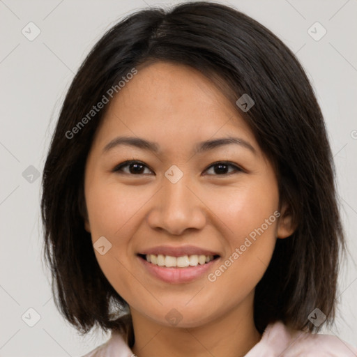 Joyful latino young-adult female with medium  brown hair and brown eyes