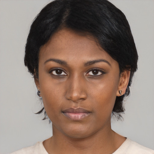 Neutral black young-adult female with medium  black hair and brown eyes