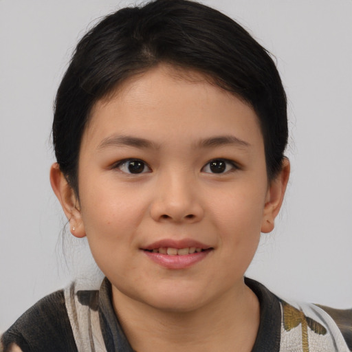 Joyful asian child female with short  brown hair and brown eyes
