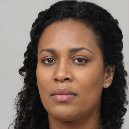 Neutral black young-adult female with long  black hair and brown eyes