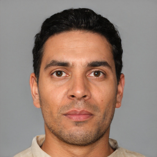 Neutral white young-adult male with short  black hair and brown eyes