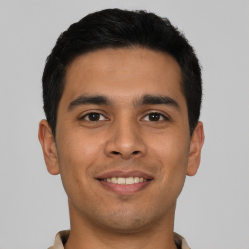 Joyful asian young-adult male with short  brown hair and brown eyes