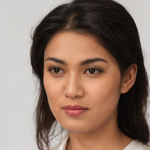 Neutral asian young-adult female with medium  brown hair and brown eyes