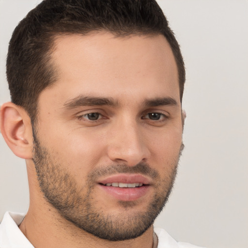 Joyful white young-adult male with short  brown hair and brown eyes