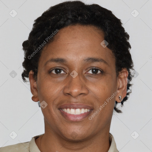 Joyful black adult female with short  brown hair and brown eyes