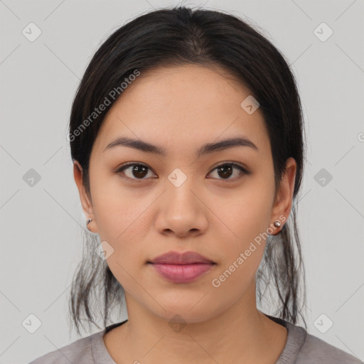 Joyful latino young-adult female with medium  black hair and brown eyes