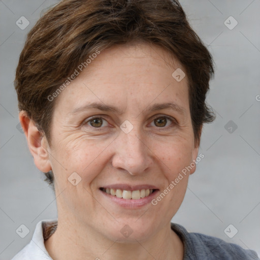 Joyful white adult female with short  brown hair and brown eyes