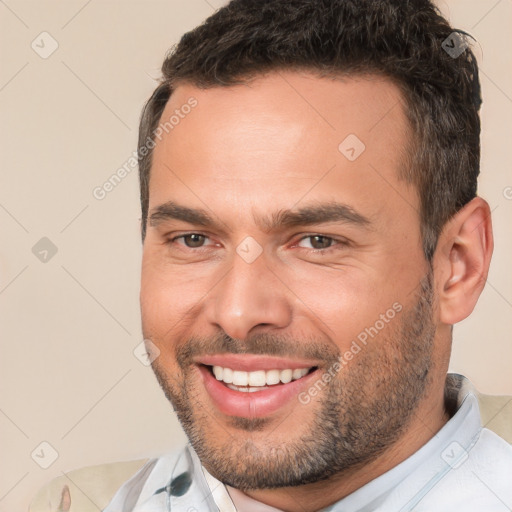 Joyful white adult male with short  brown hair and brown eyes