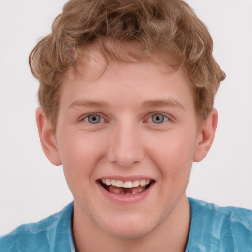 Joyful white child male with short  brown hair and grey eyes