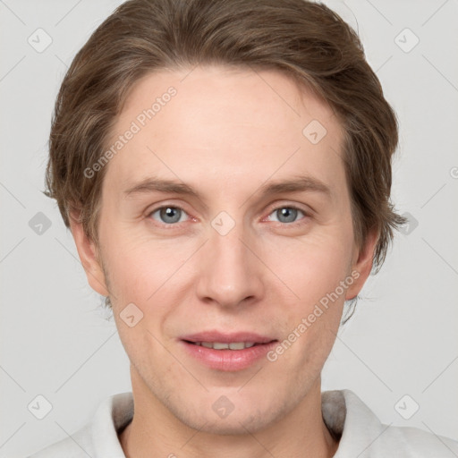 Joyful white adult male with short  brown hair and grey eyes