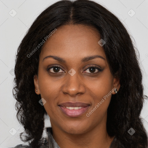 Joyful black young-adult female with long  brown hair and brown eyes