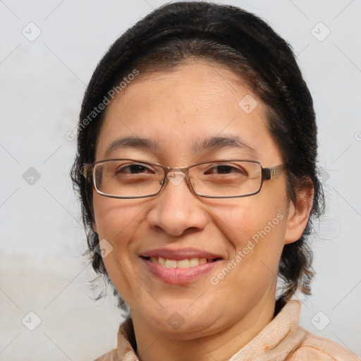 Joyful white adult female with medium  brown hair and brown eyes