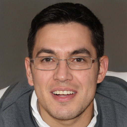 Joyful white adult male with short  brown hair and brown eyes