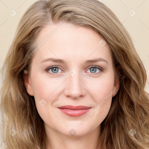 Joyful white young-adult female with long  brown hair and blue eyes