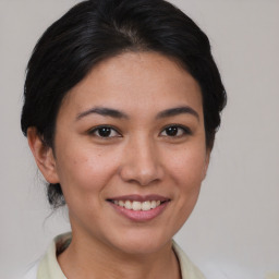 Joyful asian young-adult female with short  brown hair and brown eyes