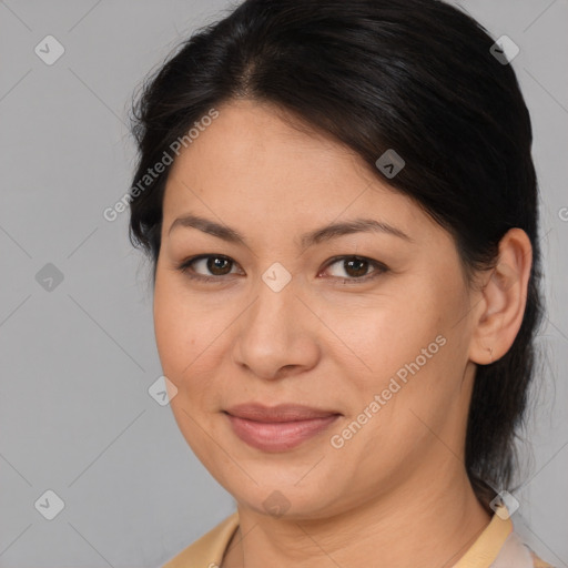 Joyful asian adult female with medium  brown hair and brown eyes