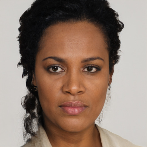 Neutral black young-adult female with short  black hair and brown eyes