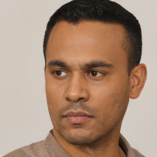 Neutral latino young-adult male with short  black hair and brown eyes