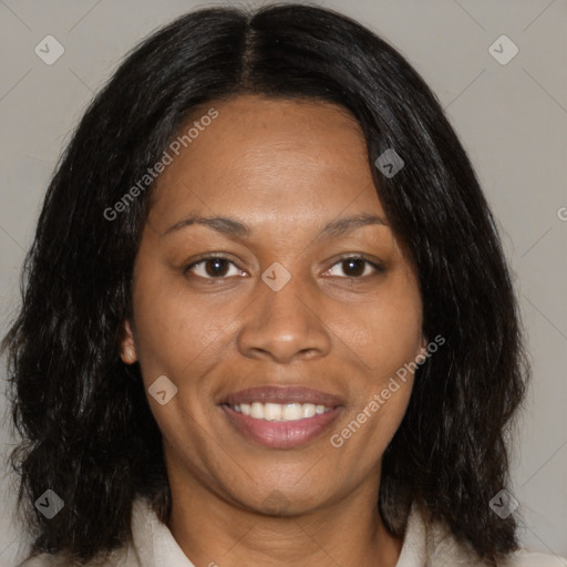 Joyful black adult female with medium  brown hair and brown eyes